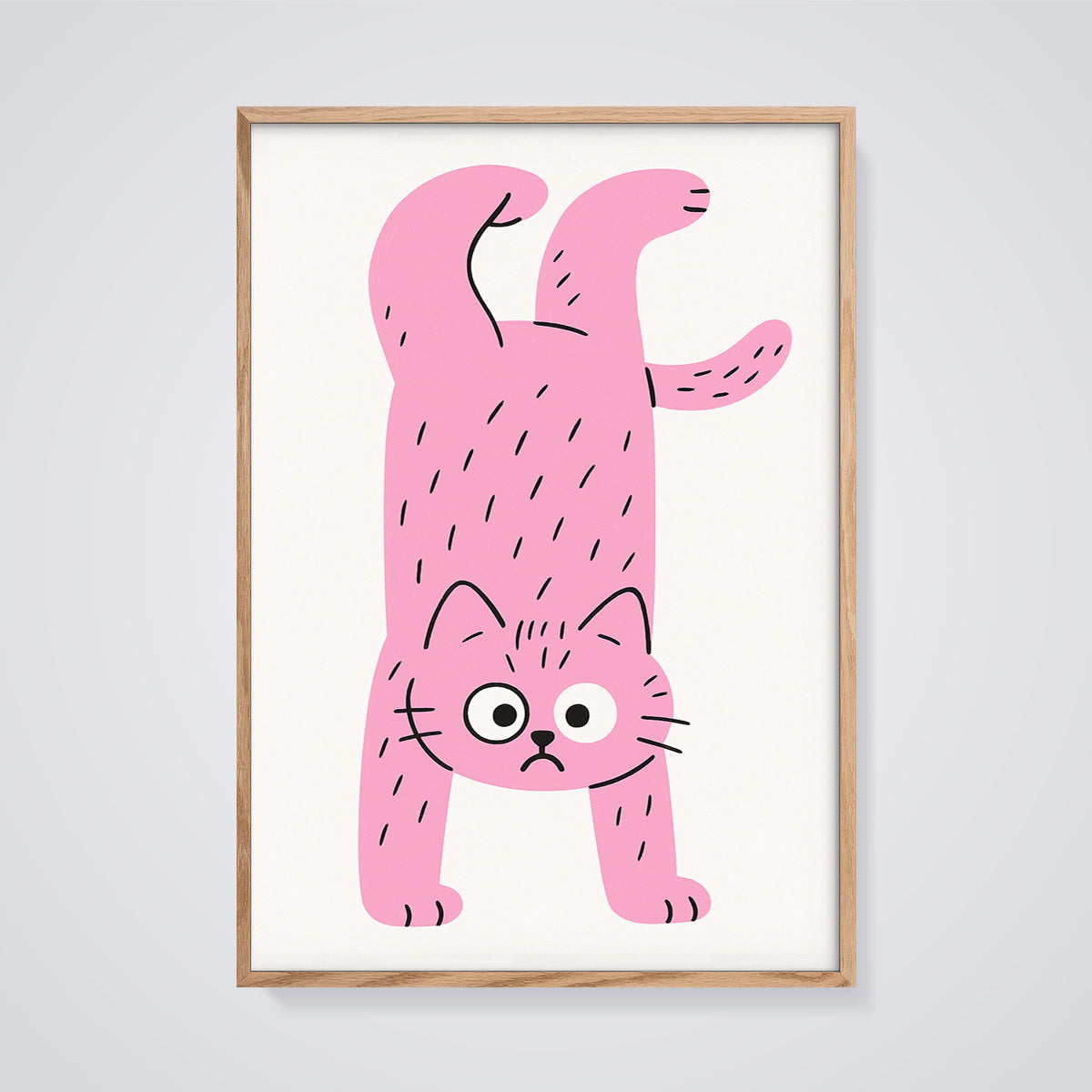 Upside Down Pink Cat Print framed in oak on a grey background