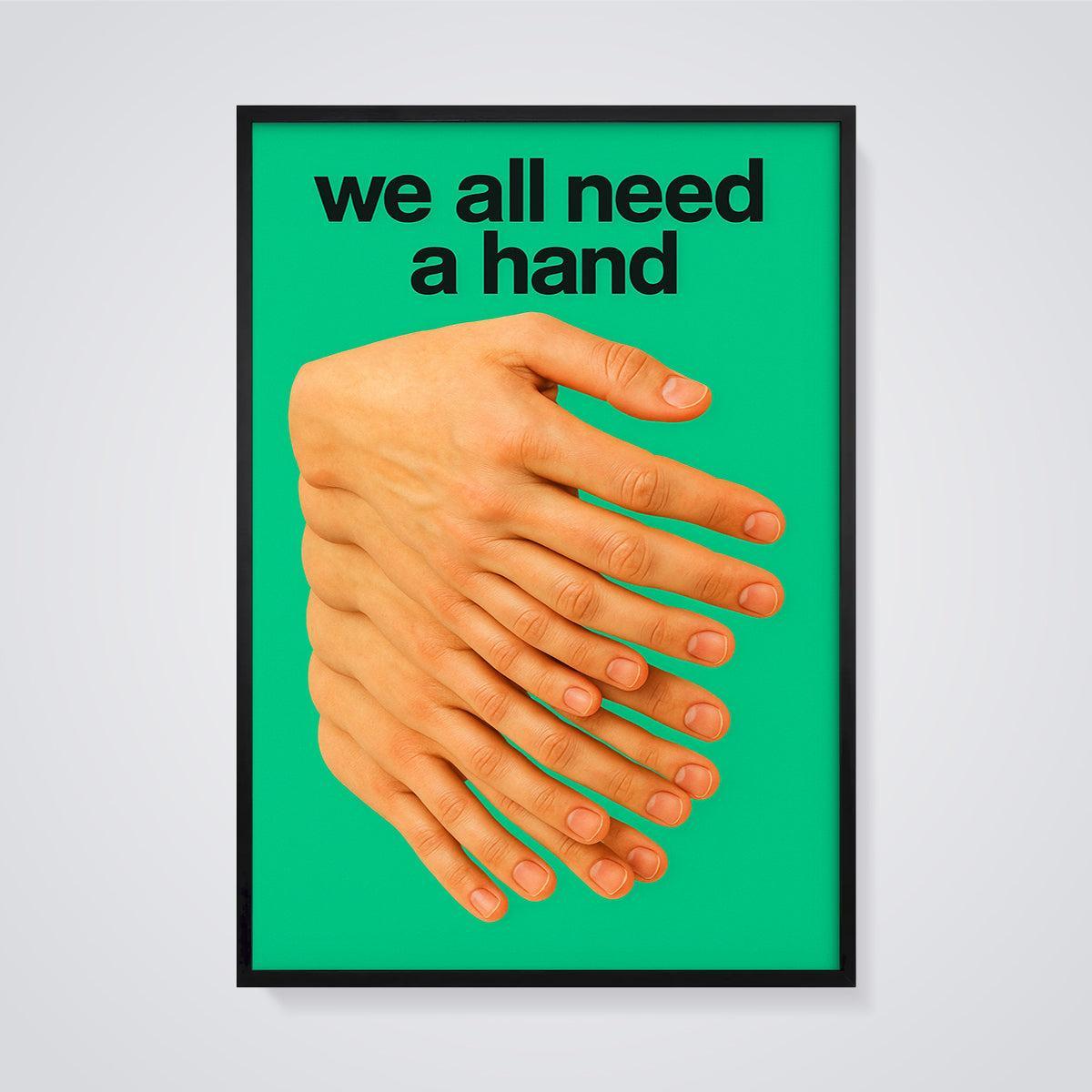 We All Need a Hand Hands Print framed in black on a grey background