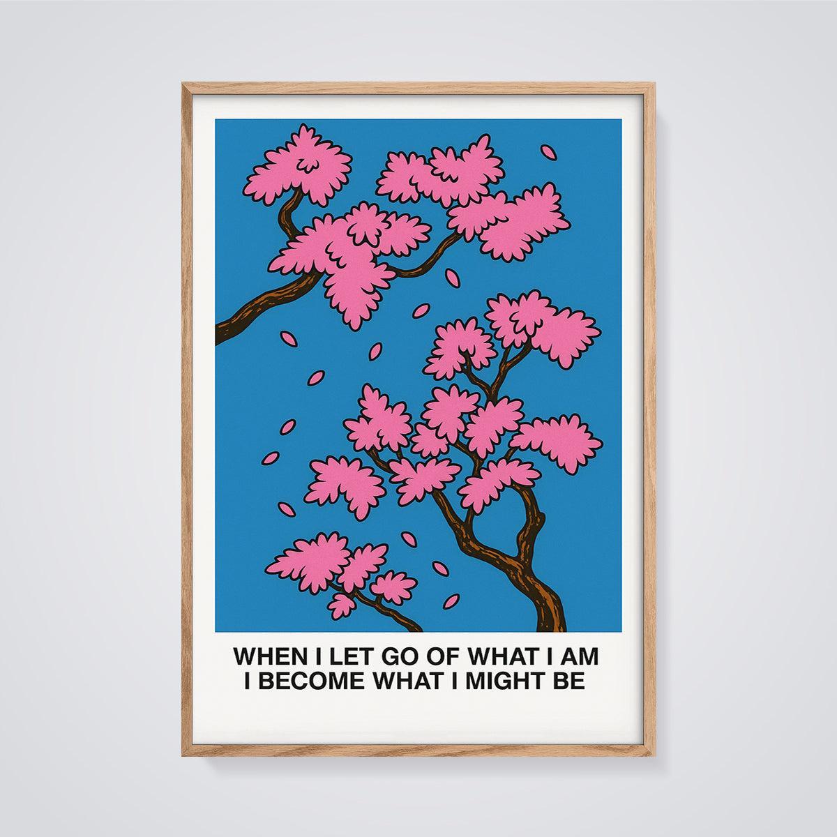 When I Let Go Cherry Blossom Print framed in oak on a grey background