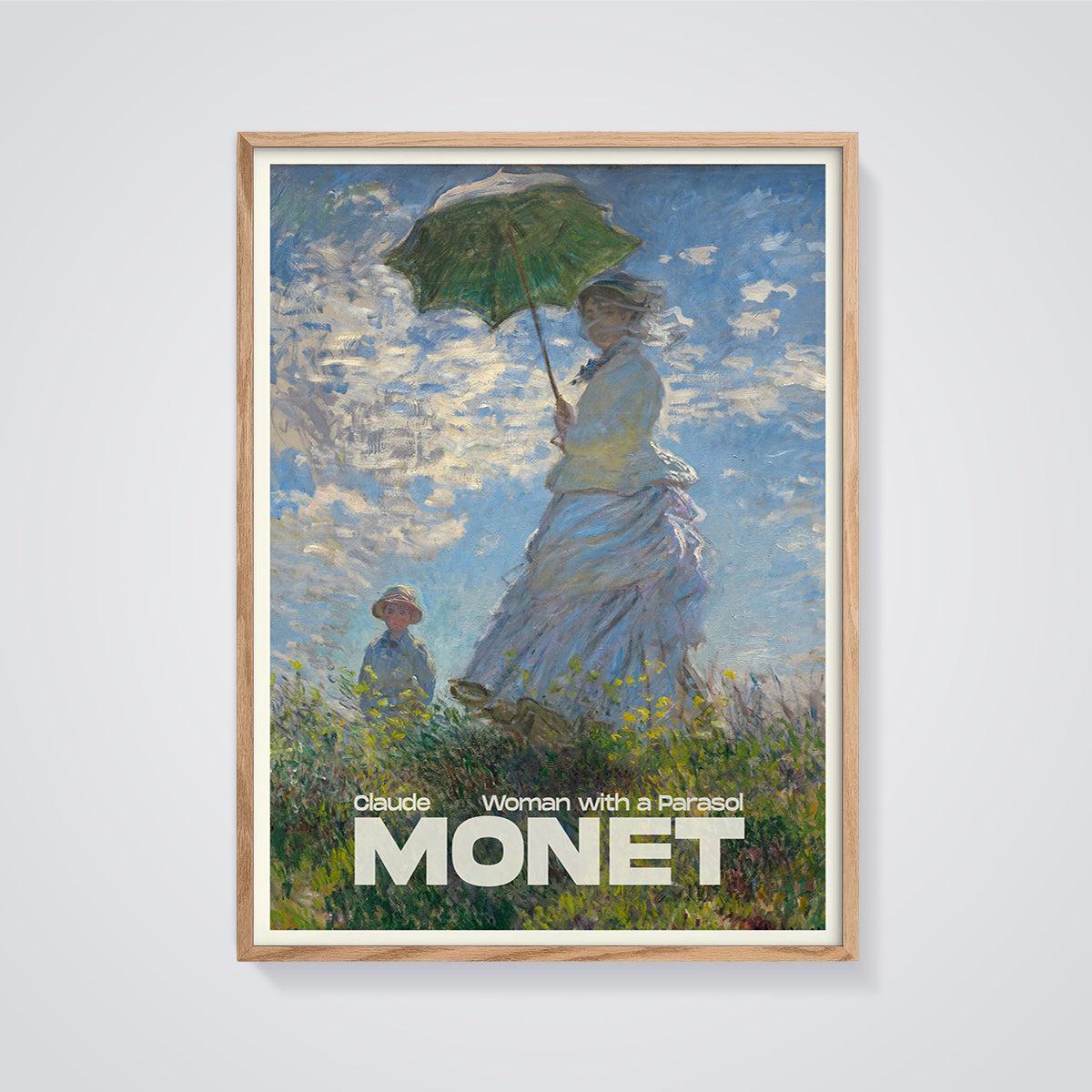 Woman with a Parasol Monet Print framed in oak on a grey background