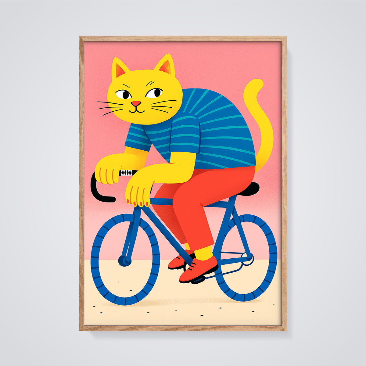 Yellow Cat on Bicycle Print framed in oak on a grey background